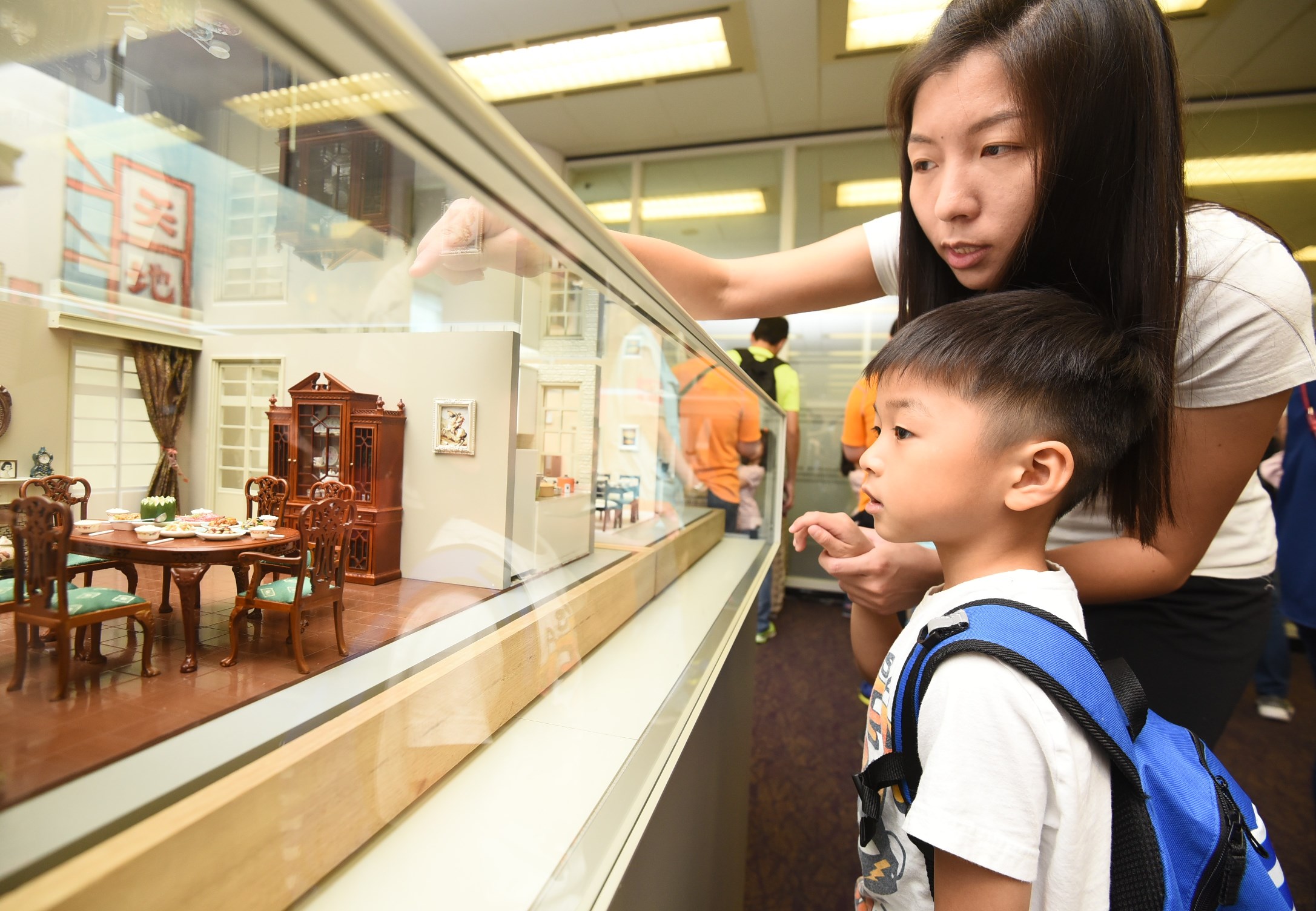 Little kid visiting the miniatures exhibition in the Central Reference Library Little kid visiting the miniatures exhibition in the Central Reference Library
