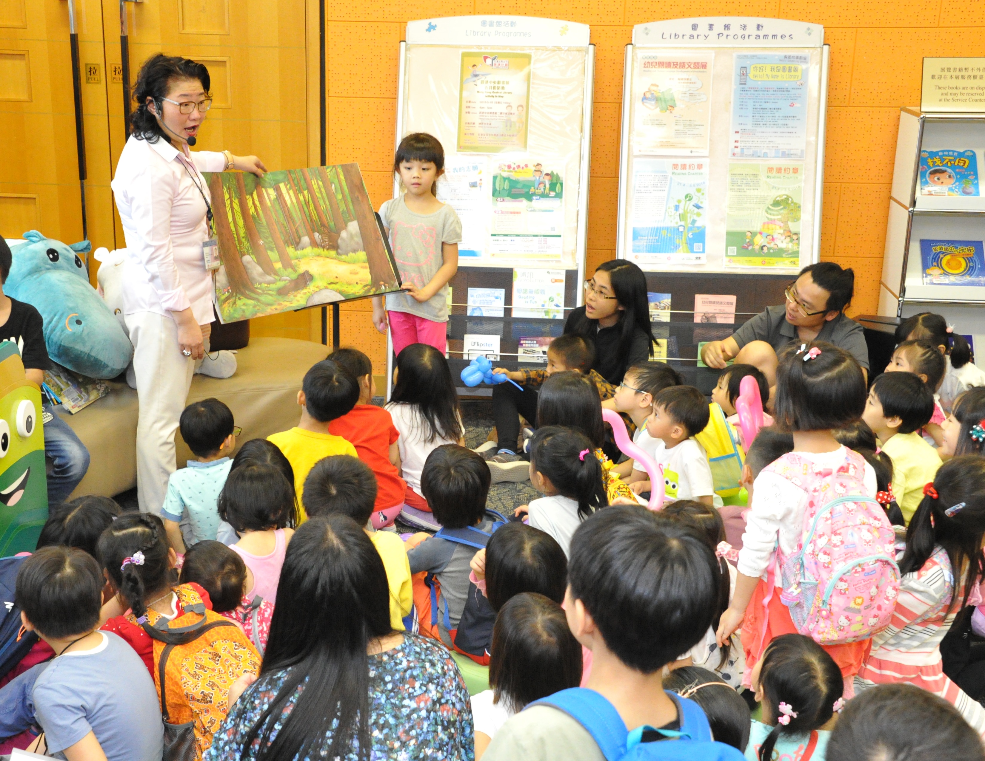 'Auntie Hippo', played by a chief librarian, reading stories to children 'Auntie Hippo', played by a chief librarian, reading stories to children